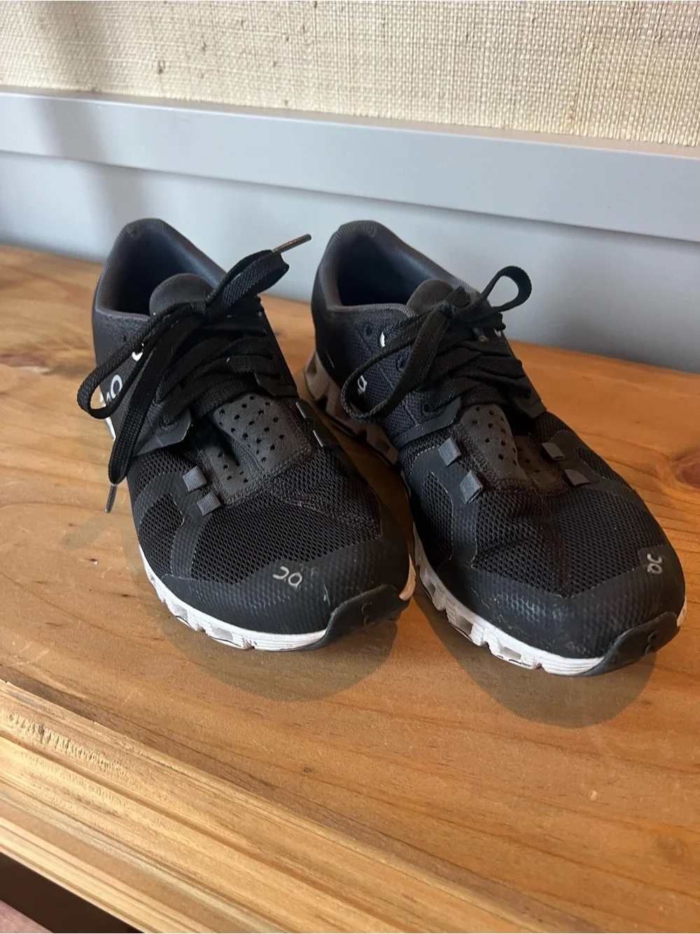 On Running Black Athletic Shoes with White Soles and Subtle Gray Accents
